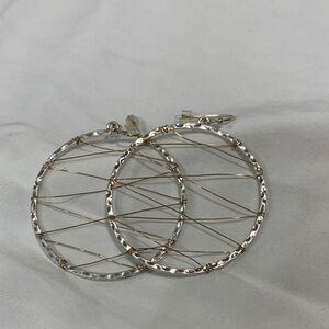 New. Never worn, Elegant Silver Hoop Earrings